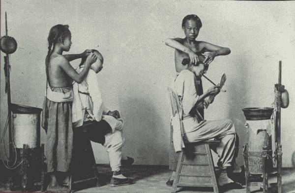 THE PERIGRINATING BARBER OF ANCIENT CHINA

If there is an "artist" on this earth, it is the Chinese barber. An hour
in his chair makes you long for a week in bed to fully recover!