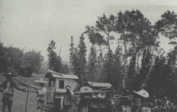 AUTHOR'S CARAVAN ON THE MARCH

On the main road west of Chung-king—the Author's four-man chair engaged
to "save his face," and his servant's two-man chair, followed by the
coolies.