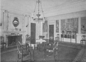 There are many details worthy of notice in this room, the
mahogany doors, the paneled walls with the old picture paper, the
over-mantel, the knife boxes on the sideboard, the Hepplewhite
furniture, and the side-lights. The chandelier is badly chosen.