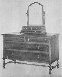 The walnut used in this adaptation of the William and
Mary period is very fine. Shaving-glasses were used throughout the
eighteenth century.