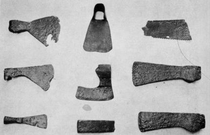 [Illustration: A few of many tools unearthed at Jamestown which were used for timbering: felling axes, a hewing axe, adze, hatchet, wedge, and saw fragment.]