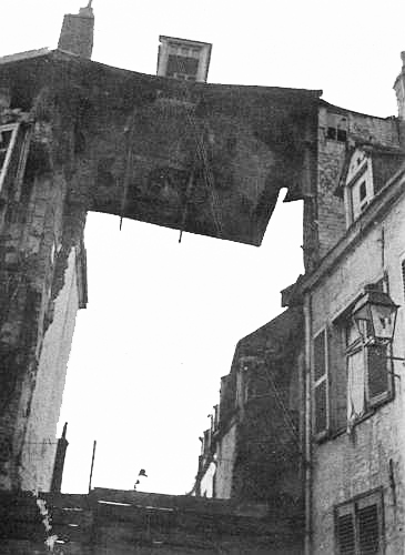 “Of another house the roof only remained, from under it the rest of
the building had been shot away.”